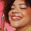 soft-pinch-tinted-lip-oil-on-figure-joy-03 Rare Beauty Soft Pinch Tinted Lip Oil - Joy